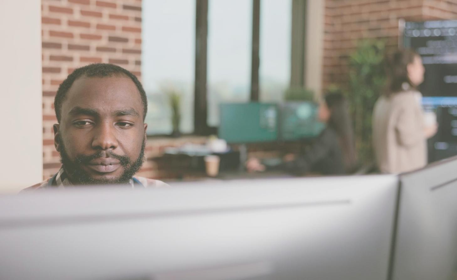 Data scientist reviewing explainable machine learning model outputs for a banking risk assessment